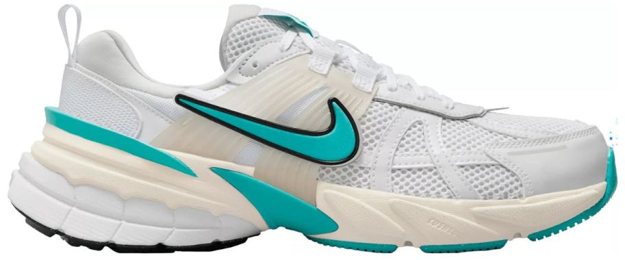 white and teal nike running shoe