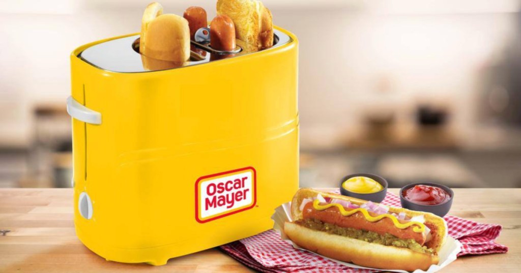 Nostalgia Oscar Meyer Hot Dog Toaster on counter next to cooked hot dog