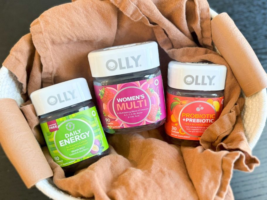 A Basket with 3 jars of Olly Vitamins inside