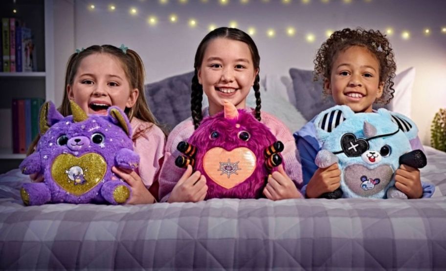 3 girls shown with rainbowcorn plushes