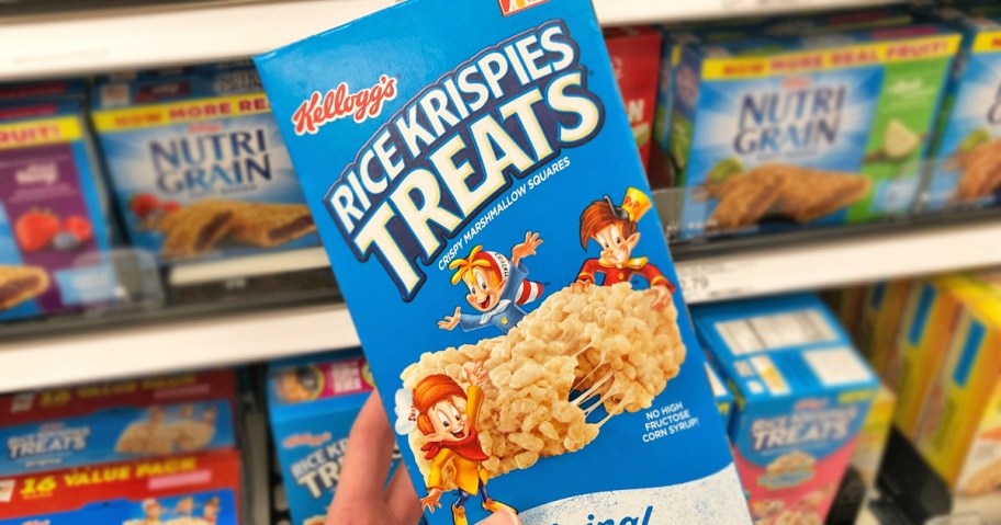 hand holding a blue box of Rice Krispies Treats in store