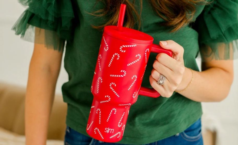 a womans hand holding a red simple modern 30oz tumbler