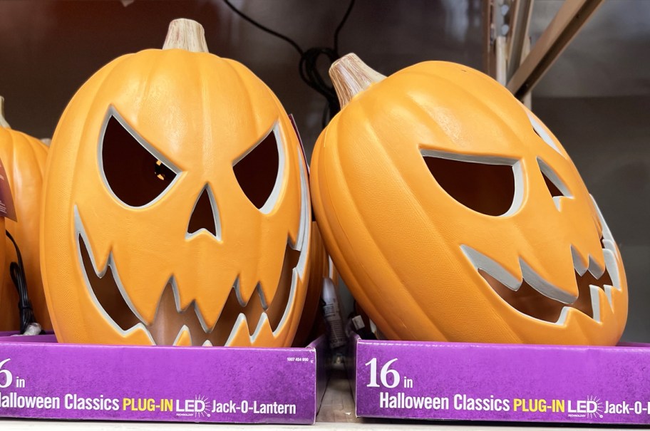 orange jack-o-lanterns on store shelf