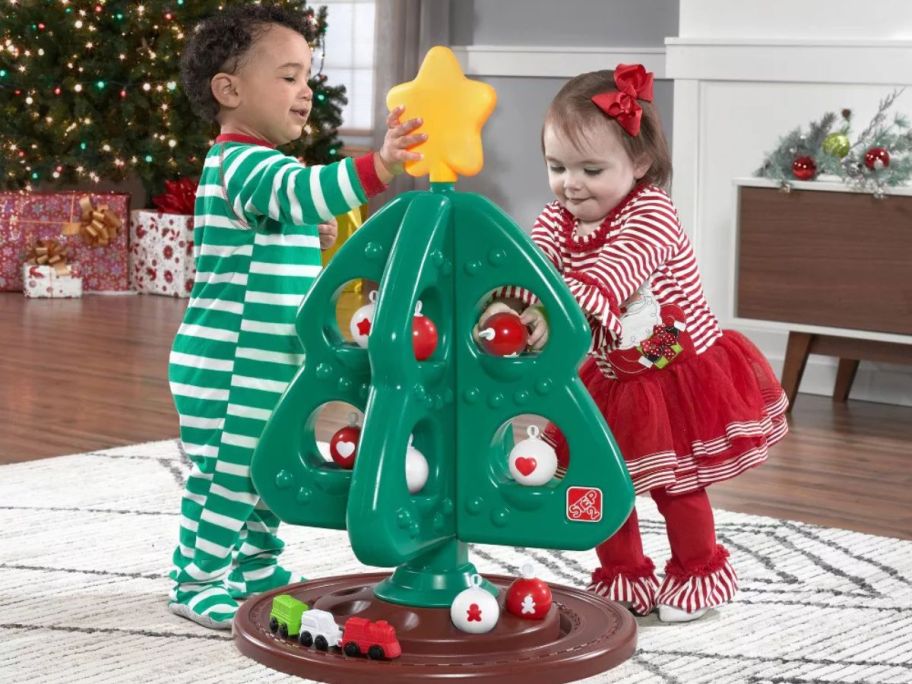 Two toddlers playing with Step2 My First Christmas Tree 