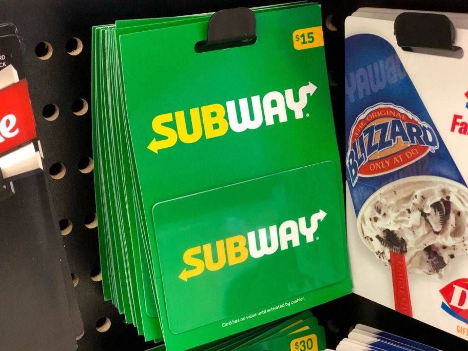 A peg with $15 Subway Gift Cards hanging on it