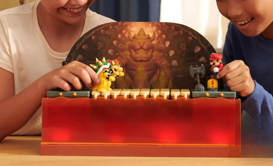 two kids playing with the bowser battle playset 