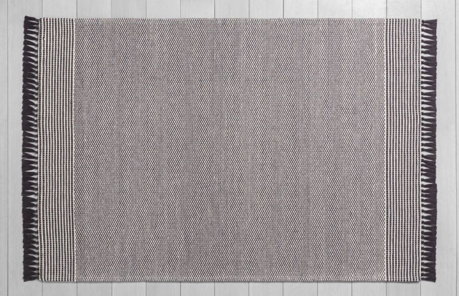 a gray textured area rug