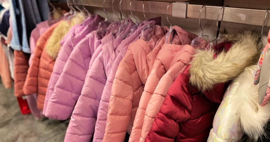 rack of the childrens place puffer coats in store