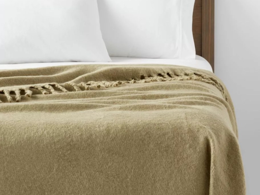 Threshold Faux Mohair Bed Throw draped over bed