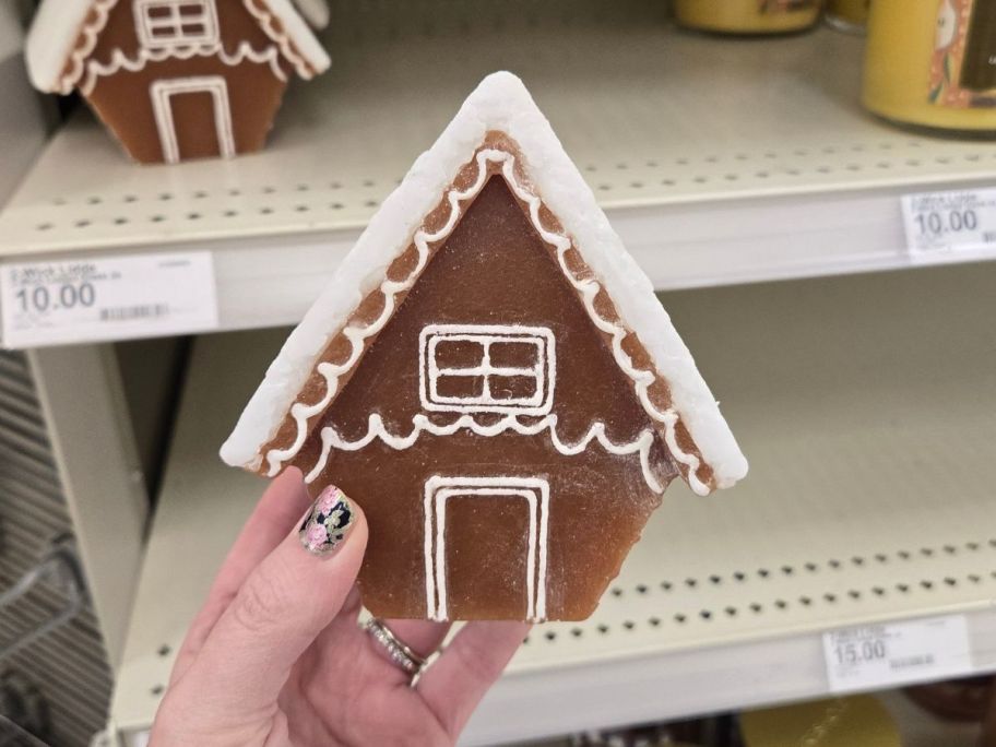 Threshold Gingerbread Frosting Figural Candle in hand in store