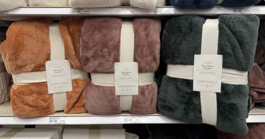 Threshold Microplush Bed Blanket in 3 colors on store shelf