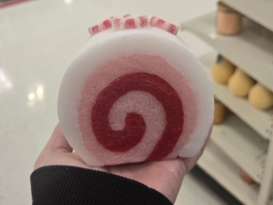 Threshold Peppermint Roll Figural Candle in hand in store