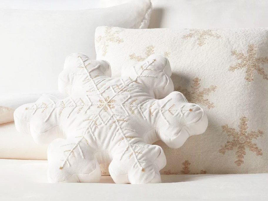 white snowflake pillows on bed