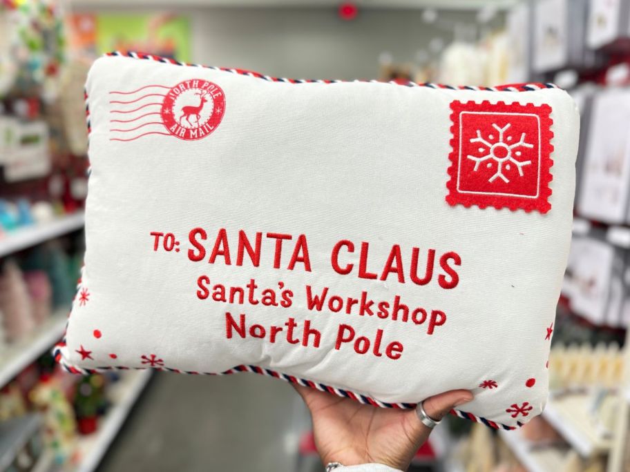 'To Santa Claus' Envelope Rectangle Christmas Novelty Throw Pillow in hand in store