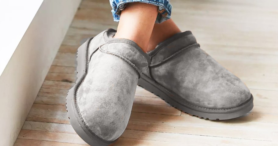 woman wearing grey ugg slippers