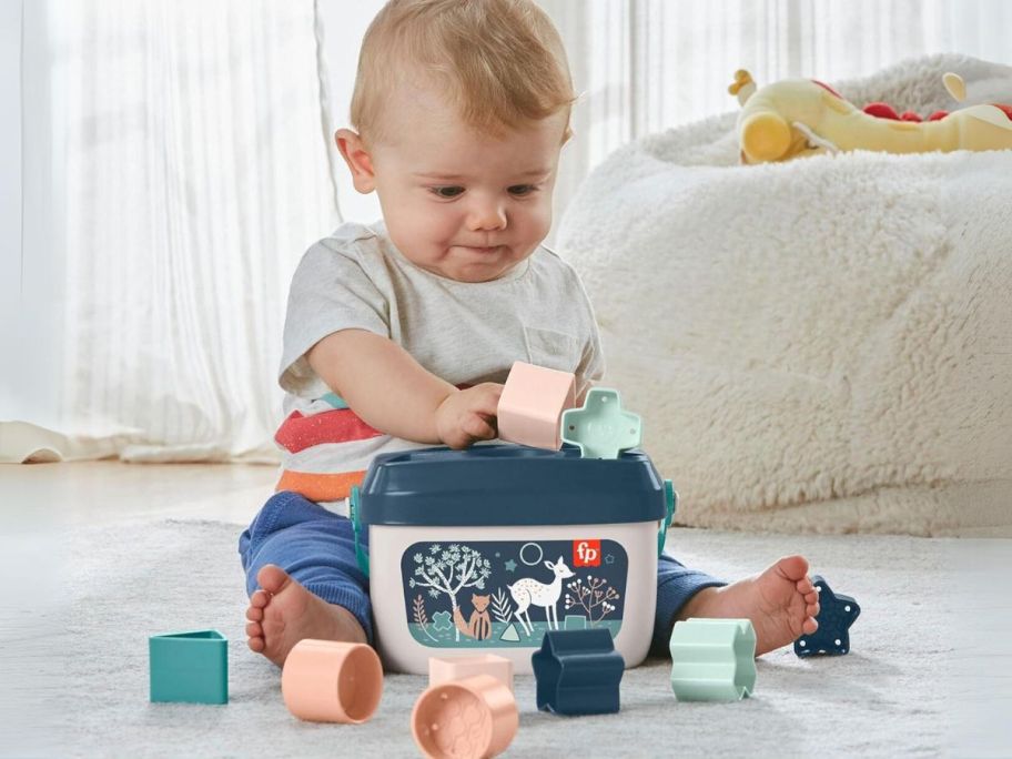 baby playing with Fisher-Price Baby's First Blocks Set