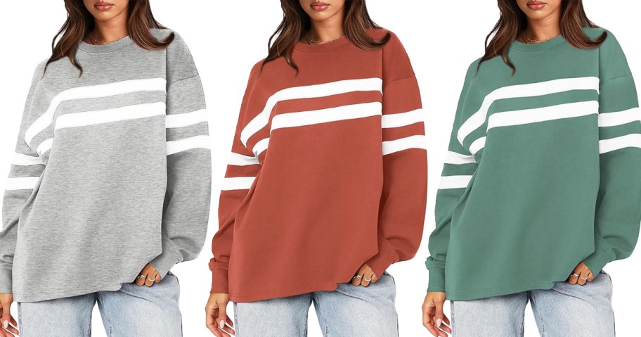 three women in grey, burnt orange, and green sweatshirts with white stripes