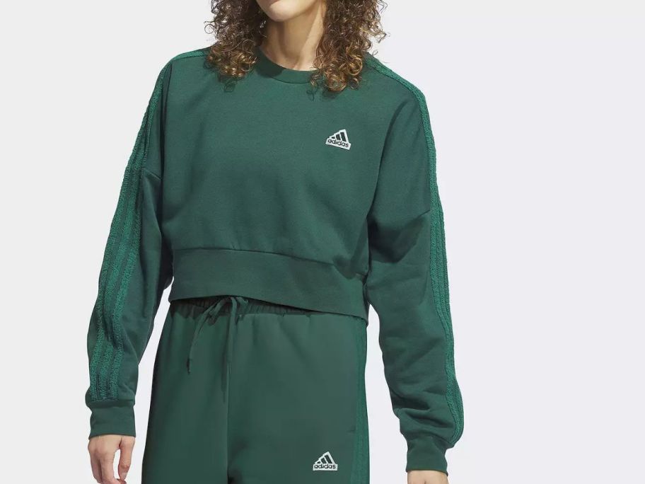 woman wearing Women's adidas Coze 3-Stripes Crewneck Sweatshirt