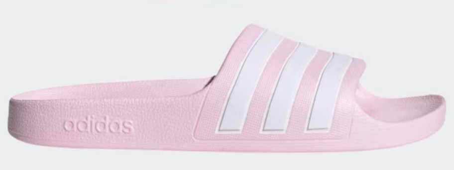 a pink and white adidas kids slide shoe