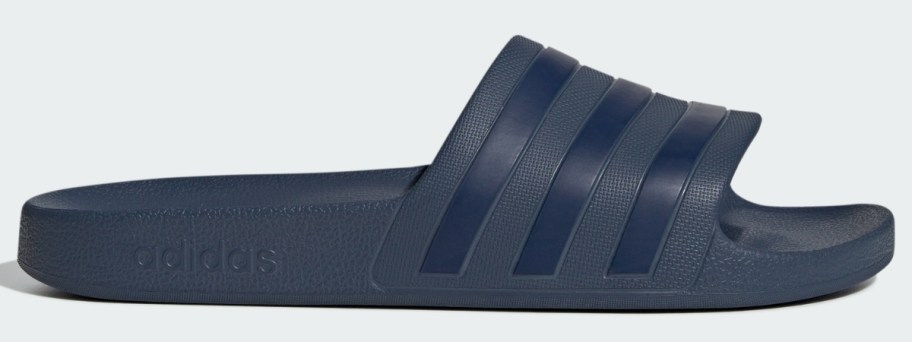 a navy blue adidas slide