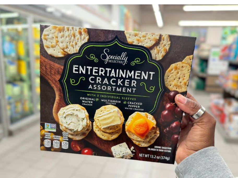 hand holding a box of Specially Selected Entertainment Crackers in an Aldi