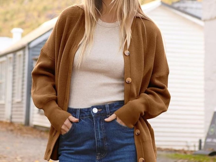 woman wearing tan cardigan over tan shirt and jeans