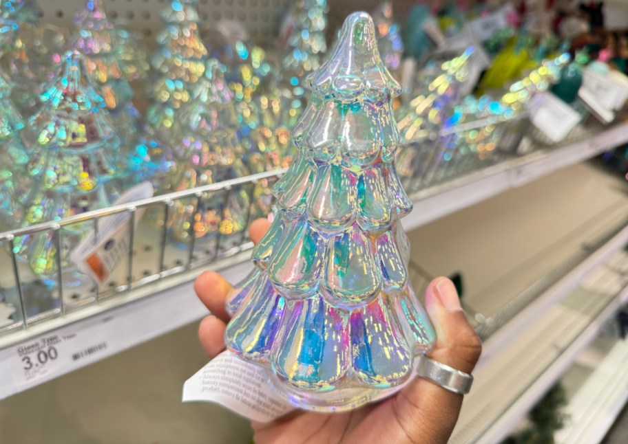 hand holding iridescent glass tree