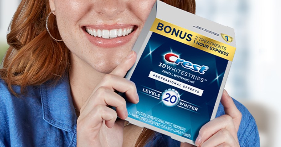 woman holding box of crest whitestrips