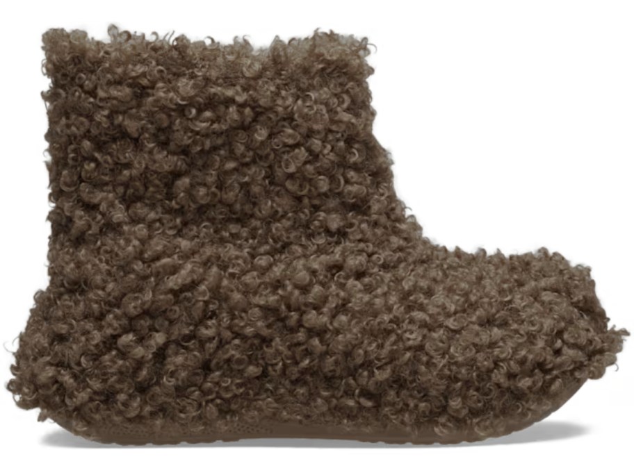 a Crocs boot with dark brown faux doodle dog like fur on the outside and inside