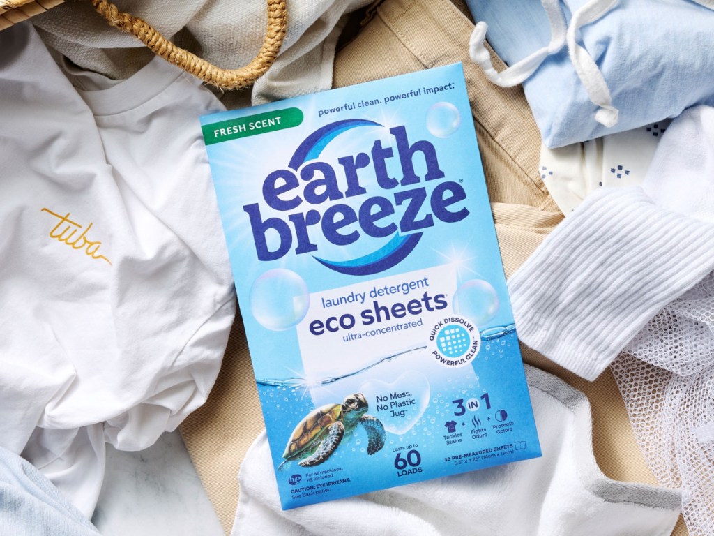 box of earth, breeze, fresh scent, laundry detergent, sheets on top of basket of laundry