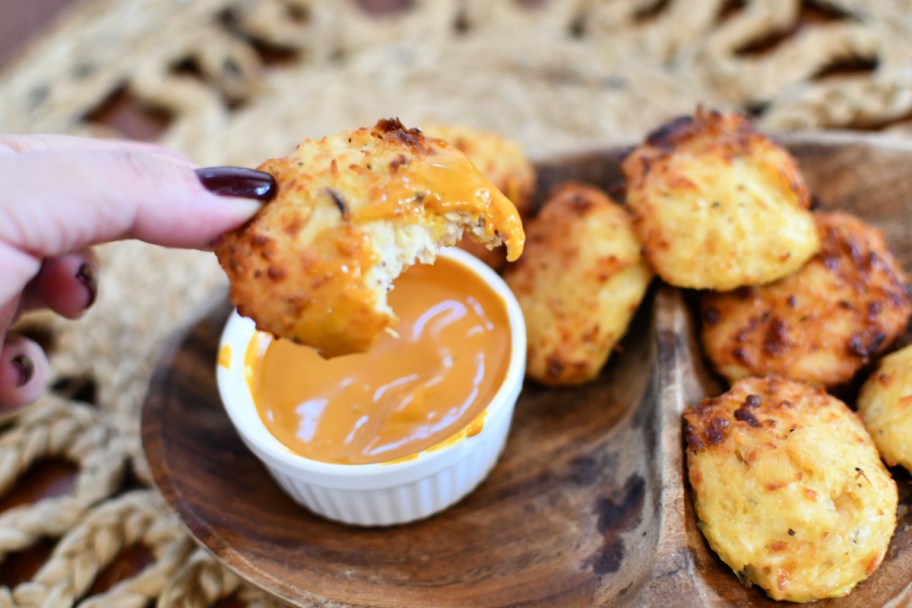 eating a chicken nugget made from canned chicken