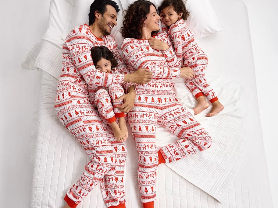 family wearing red and white candy cane pajamas