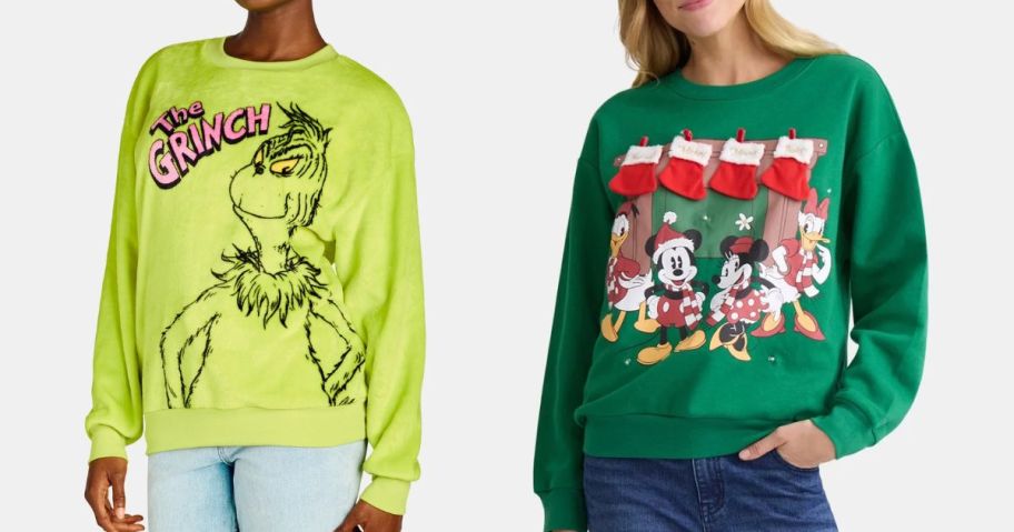 two women wearing a grinch and mickey sweatshirt