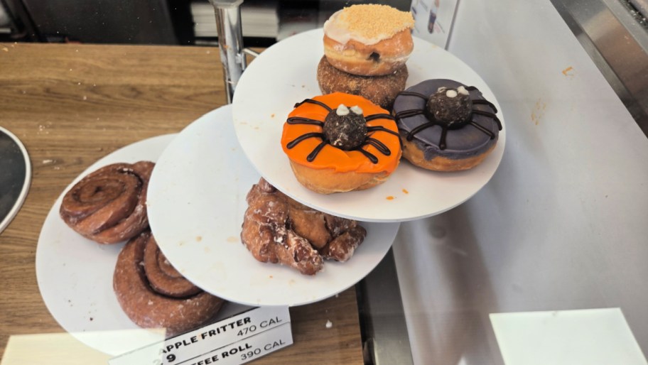 halloween and fall themed donuts on display at dunkin