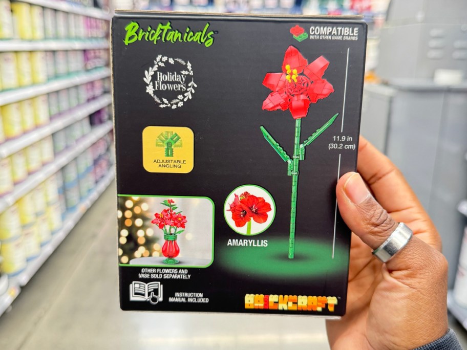 hand holding Brickcraft Bricktanicals Holiday Flowers Amaryllis Building Kit 102 Piece Set