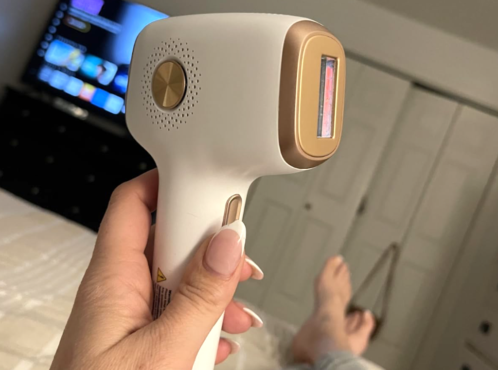 holding IPL laser hair removal 