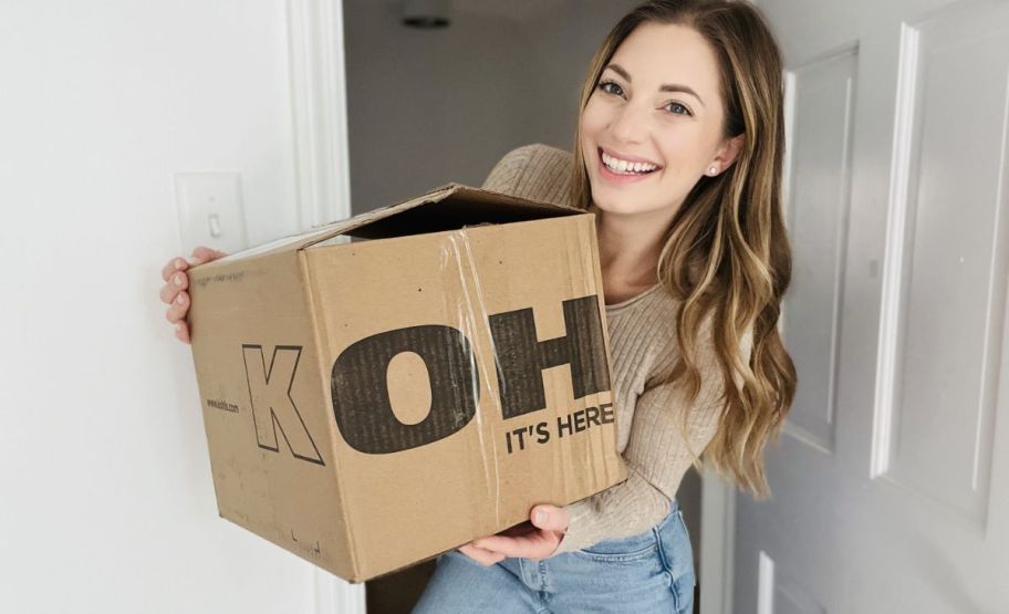 Woman holding a Kohl's shipping box