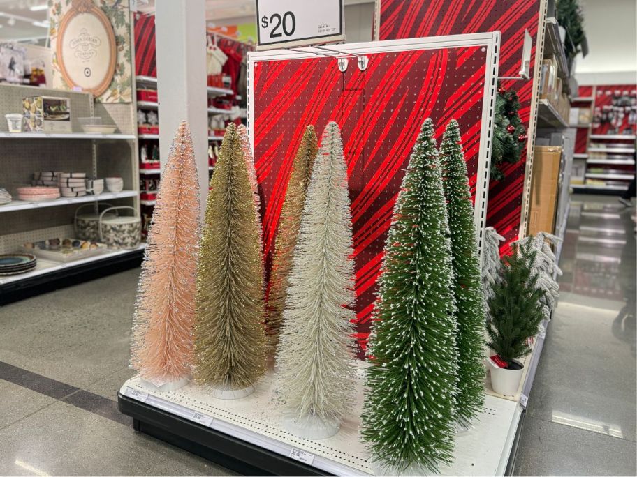 bottle brush christmas trees on an end cap in a store