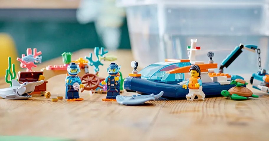 lego boat set with mini figs on table