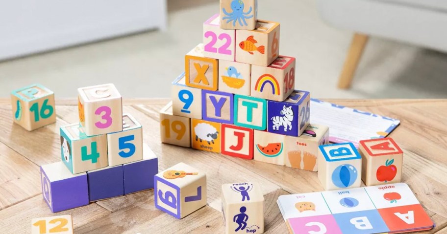 ms rachel learning blocks stacked on table