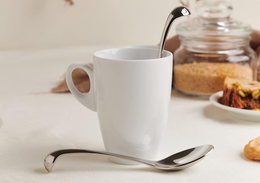 cup with a tea spoon on table