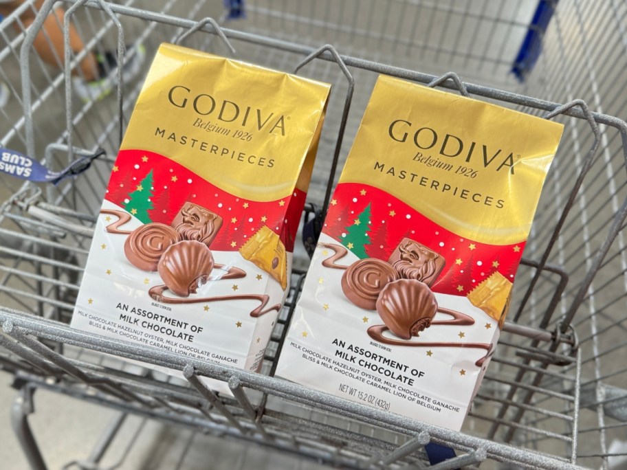 2 bags of Godiva Holiday Masterpieces Assorted Milk Chocolates in a Sam's Club cart