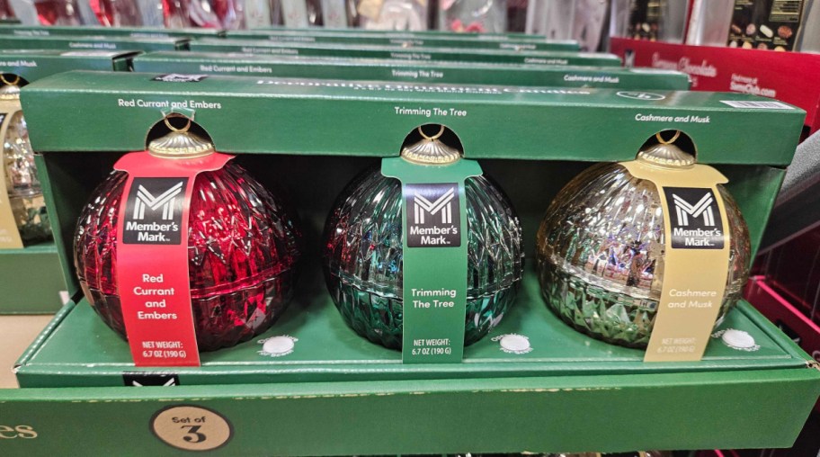 three glass ornament candles on display at sams club
