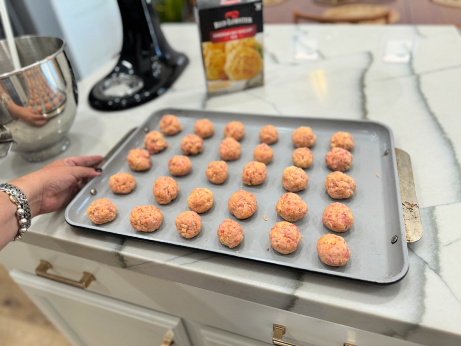 sausage balls on a baking sheet pan