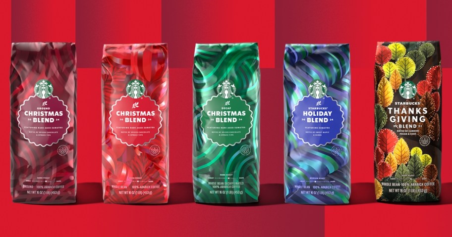 image shows 5 bags of Starbucks whole bean coffee in holiday blends on a red background