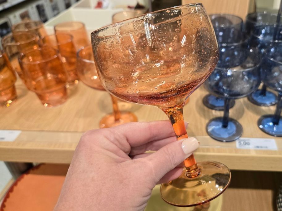 Threshold 11.16oz Peach Wine Glass in hand in store