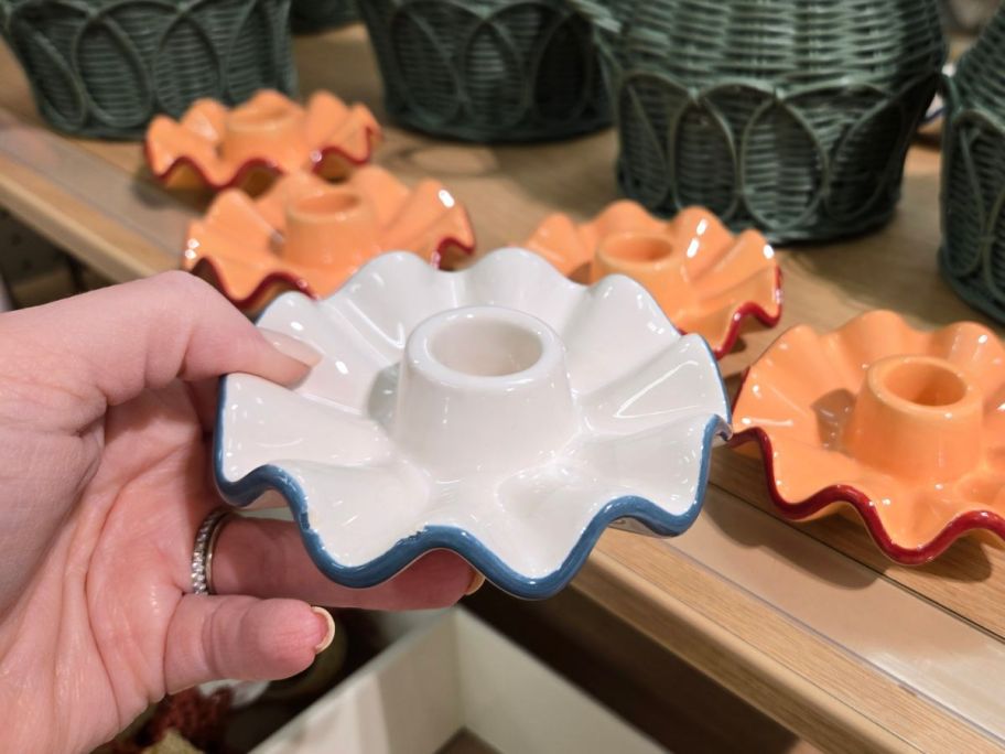 blue and white Threshold Blue Candle Holder in hand in store