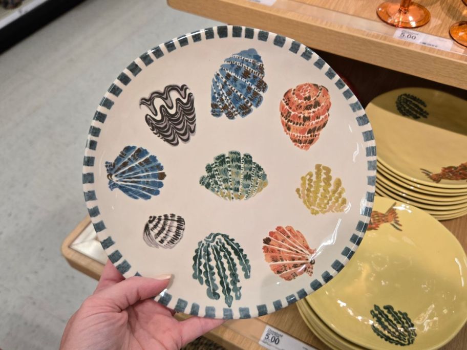 Threshold 9" Stoneware Dinner Plate with shell pattern in hand in store