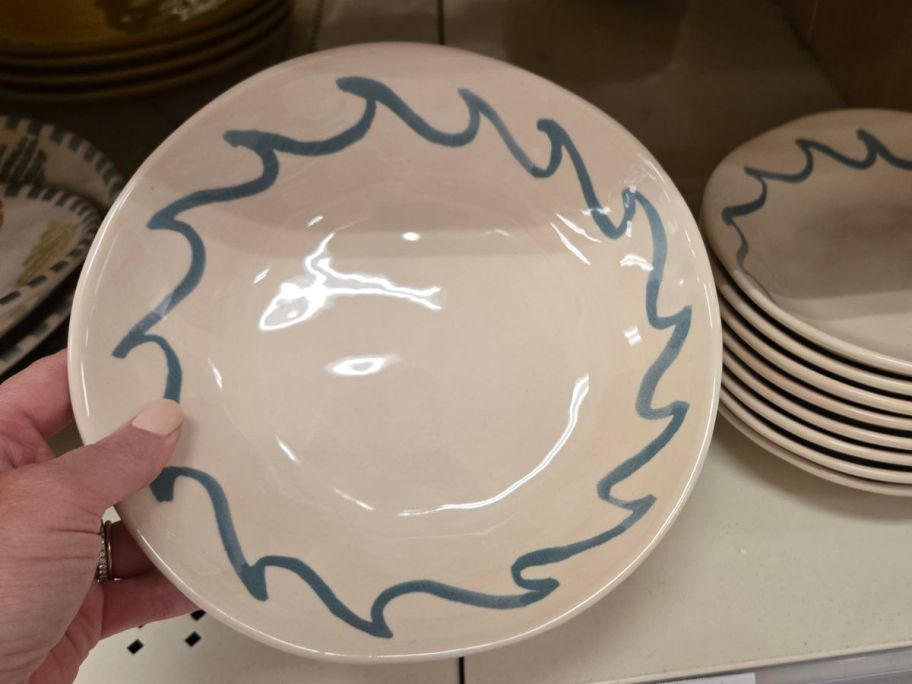 blue and white Threshold Stoneware Dinner Bowl in hand in store