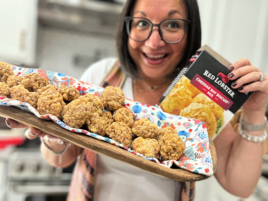 woman holding cheddar bay sausage balls